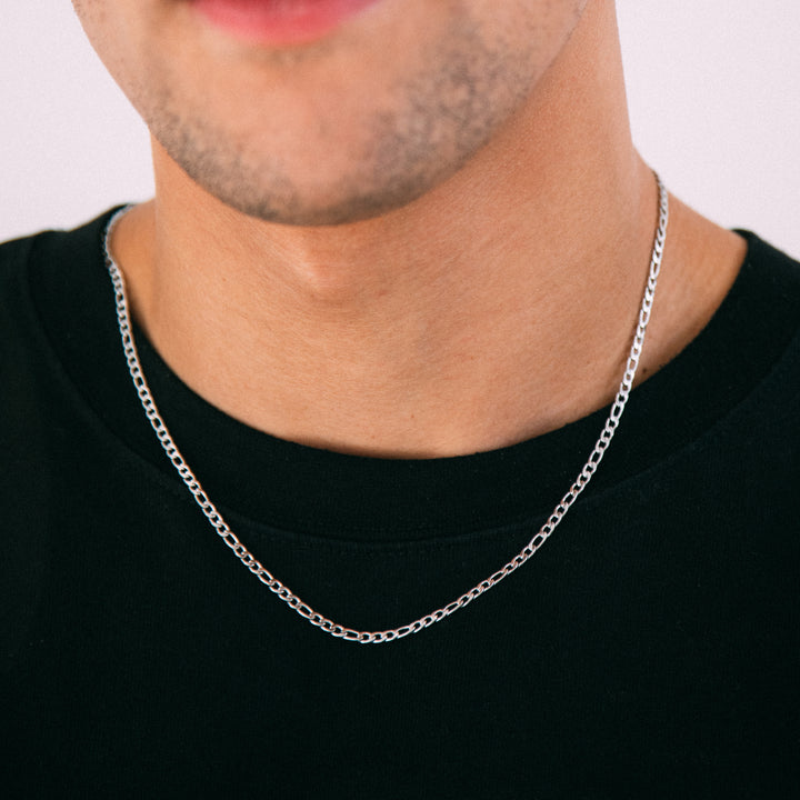 Model wearing mens 3mm silver figaro chain necklace