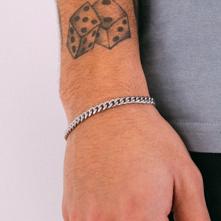 Model wearing mens 4.5mm silver cuban chain bracelet
