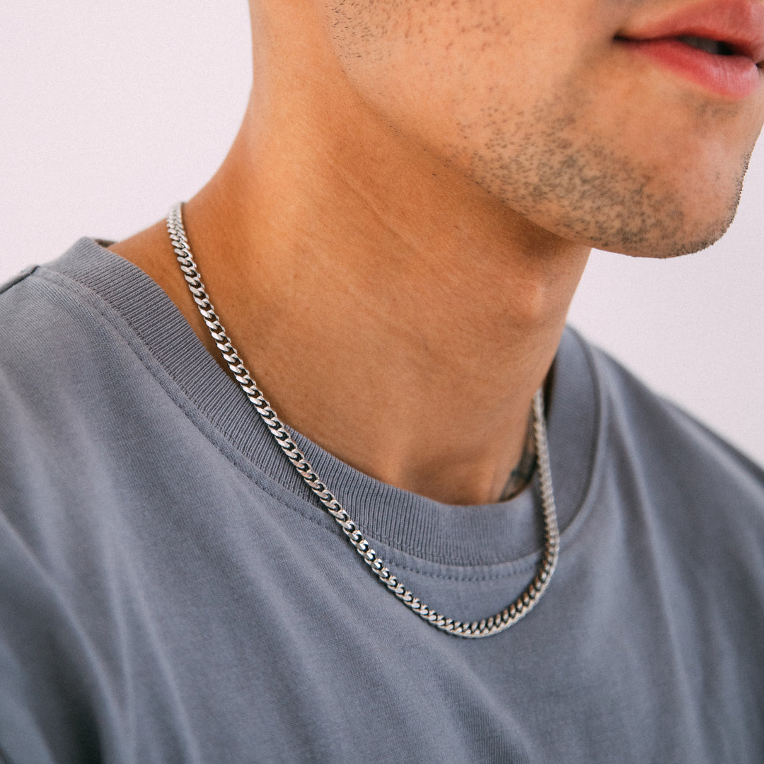 Model wearing mens 4.5mm silver cuban chain necklace