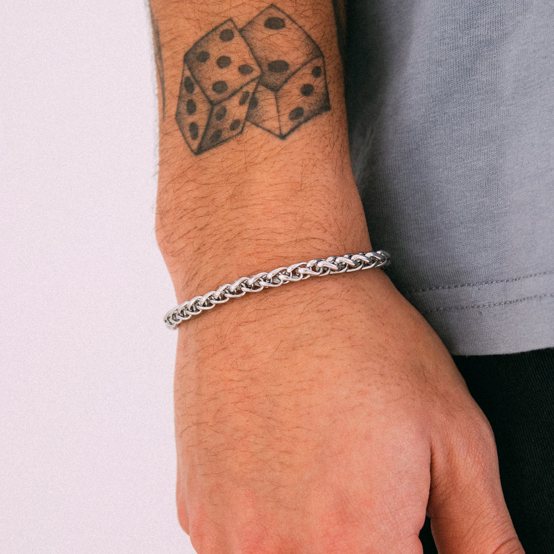 Model wearing mens 5mm silver wheat chain bracelet
